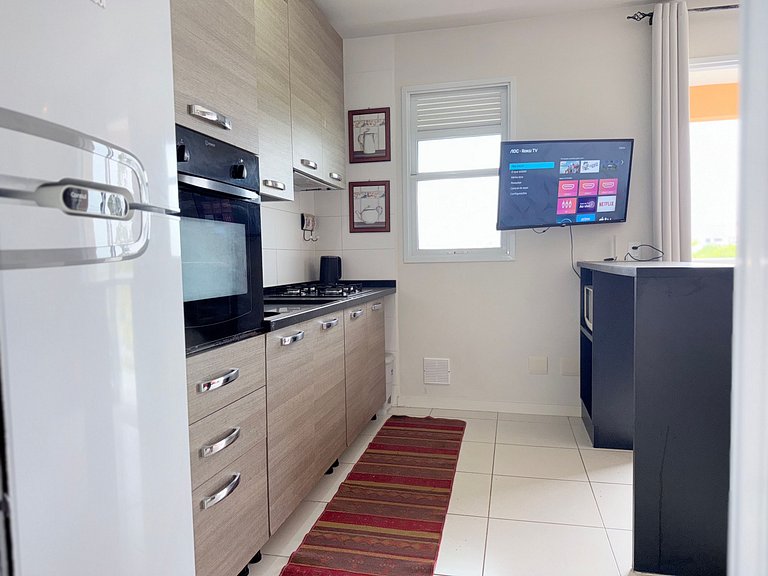 Relaxe nesse apê na praia e c/ piscina